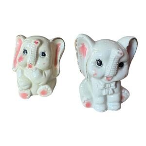 Set of two porcelain playful baby elephants.